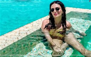 Refreshing beauty Roshni Chopra poses in the pool